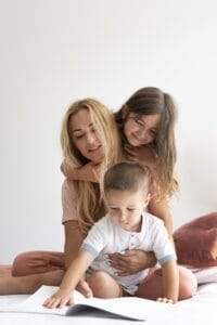 Mother spending quality time with children doing learning activities for social emotional development