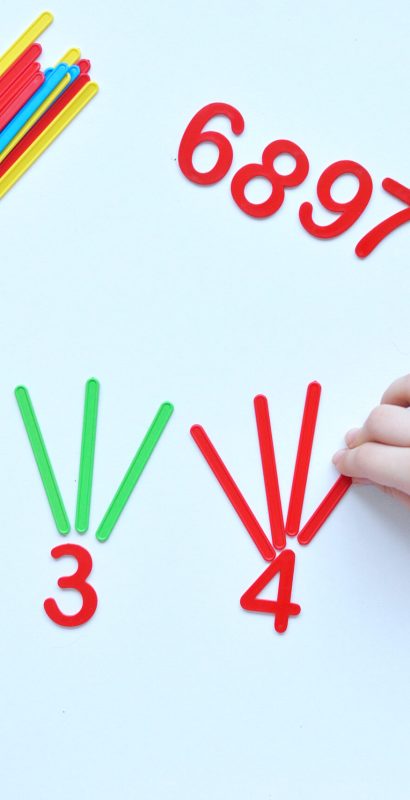 The child learns Number line and geometric shapes. The preschooler works with Montessori material. Educational logic toys for kid's. Children's hands close-up. Montessori Games for Child Development